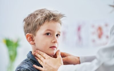 Picture of little boy having medical examination by pediatrician